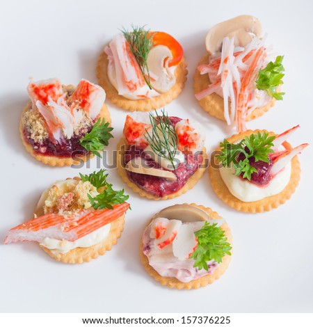 group of canapes with seafood snacks on plate