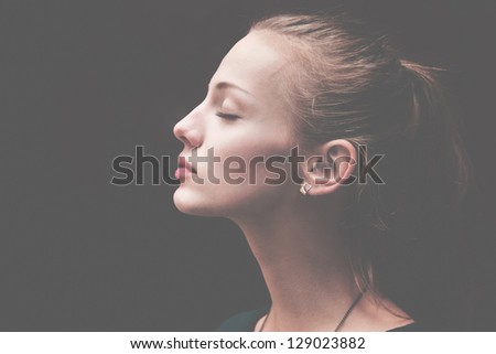 Young woman portrait with broken heart
