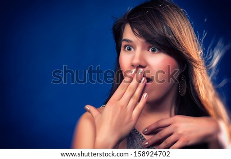 Beauty girl with black hair shocked. Fashion woman portrait.