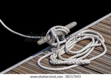White rope tied up on a cleat