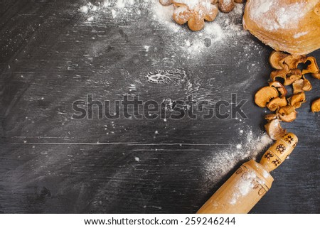 flour on the black board. Rustic kitchen or bakery