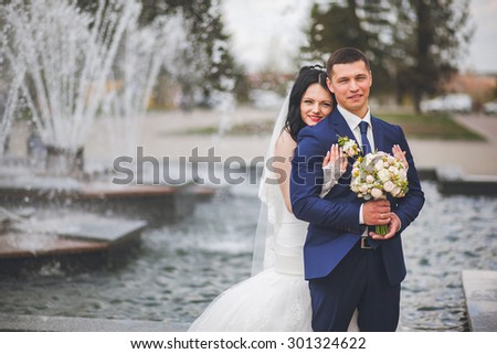 Beautiful bride at the fountain