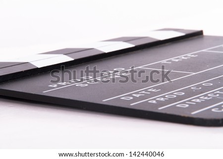 Blank black film clapper board, isolated on white background.