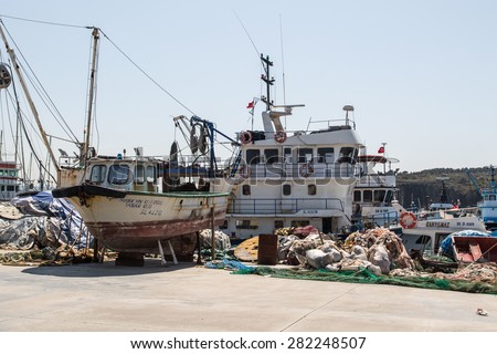 ISTANBUL, TURKEY - APRIL 12, 2015: Front view of fishing boats, fishermen\'s nets and ropes.