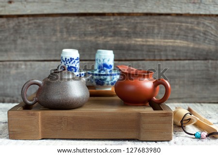 Traditional chinese tea ceremony accessories (tea pot and tea jar) on the tea table