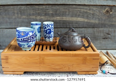 Traditional chinese tea ceremony accessories (tea pot and tea pair) on the tea table