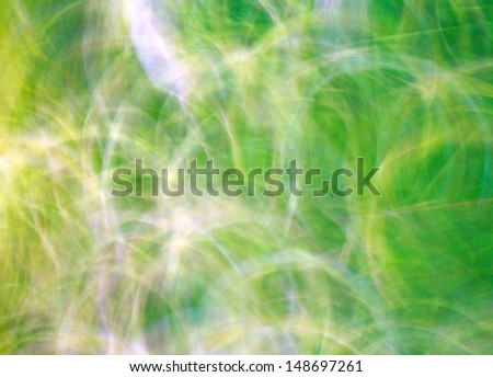 Photo art, bright Colorful light streaks abstract background in yellow and green colors