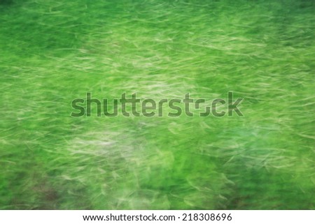Photo art, bright Colorful light streaks abstract background in green color, effect of movement