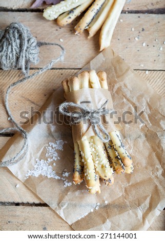 Homemade bread sticks with sesame and poppy seeds, selective focus