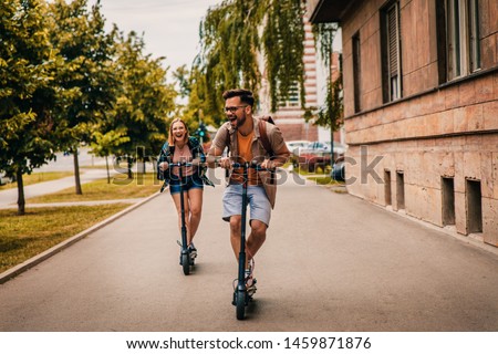 Similar – Image, Stock Photo Happy diverse women riding longboard on road