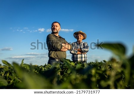 Similar – Image, Stock Photo Crop of a man holding his skateboard