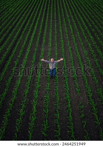 Similar – Image, Stock Photo Aerial view of farmer cleaning dirt of combine in agricultural field