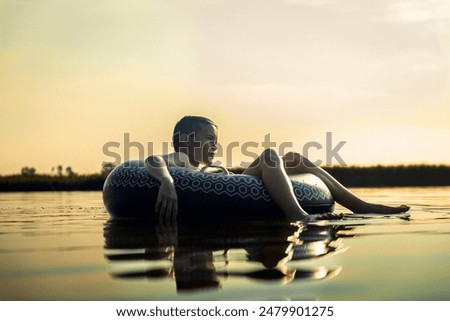 Similar – Image, Stock Photo Rubber ring on pier near lake