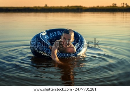 Similar – Image, Stock Photo Rubber ring on pier near lake