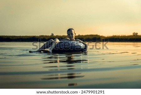 Similar – Image, Stock Photo Rubber ring on pier near lake