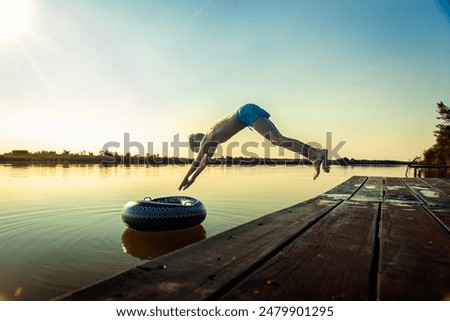 Similar – Image, Stock Photo Rubber ring on pier near lake