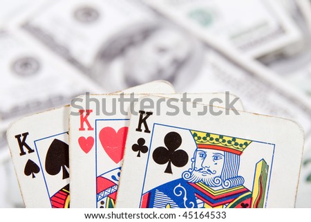 poker cards with money on the table