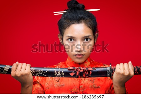 Asian woman holding a sword