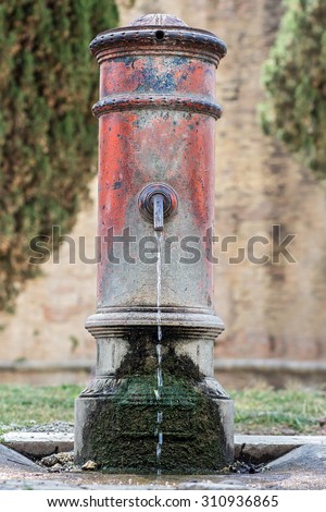 Drinking water running from an old water well in center Rome, Parco Adriano