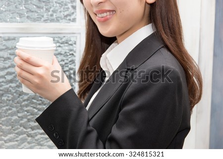 Asian woman with hot drink