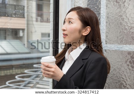 asian woman with hot coffee