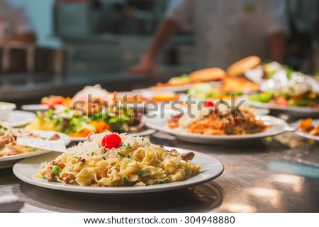 Food orders on the kitchen table in the restaurant