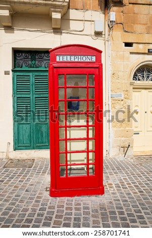 Marsaxlokk, Malta - Feb 22, 2015:Traditional red phone booth in Malta