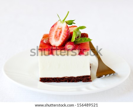 Strawberry and banana jelly mousse cake, selective focus