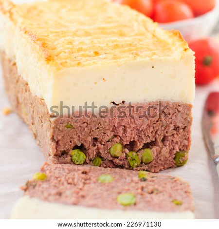 Beef Meatloaf with Green Peas Topped with Cheesy Mashed Potato, close up, square
