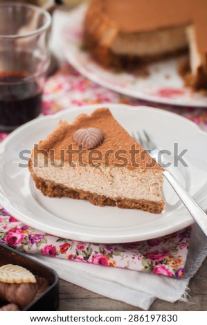 A Slice of Spiced Coffee Cheesecake Dusted with Cocoa Powder, copy space for your text
