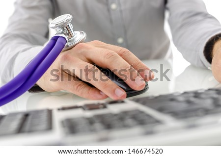 Stethoscope on male hand using computer. Concept of modern problem of internet addiction.