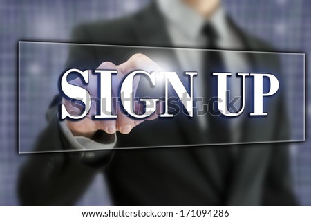 Sign Up in text on a virtual screen in a computer navigation bar with a businessman activating the button with his finger from behind as he opens an account or registers on a website
