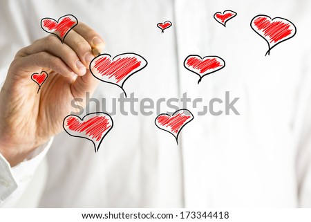 Hand-drawn hearts on a Valentines greeting card design in a random scattered pattern with copyspace for your message to your sweetheart