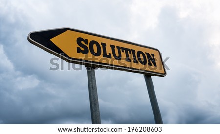 Word Solution written on yellow street sign with left pointing arrow.