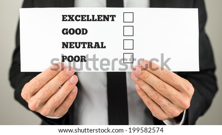 Businessman holding a survey check with multiple choice check boxes for excellent - good - neutral - poor ratings.