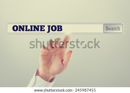 Businessman pushing a search bar on a virtual computer screen with Online job text. Retro filter effect.