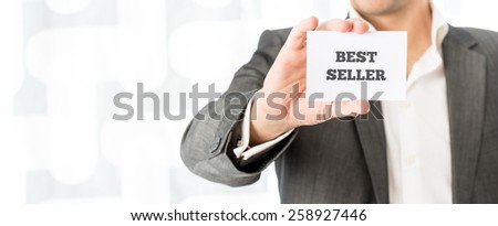 Successful merchant showing a Best seller business card promoting his services.