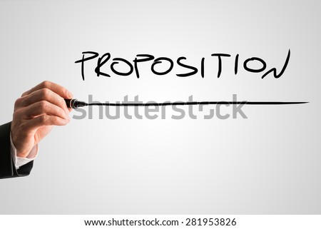 Businessman Hand with Marker Writing Underlined Proposition Text Against Abstract Gray Background.
