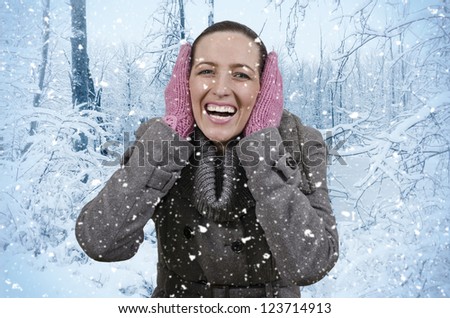 Young beautiful woman in nature when it snows