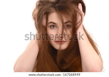 Young girl with messy long brown hair. Bad hair day.