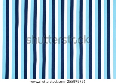 Navy blue striped background. Blue and white vertical stripes fabric pattern.
