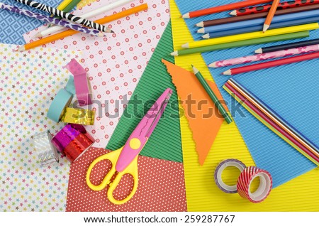Arts and craft supplies. Color paper, pencils, different washi tapes, craft scissors.
