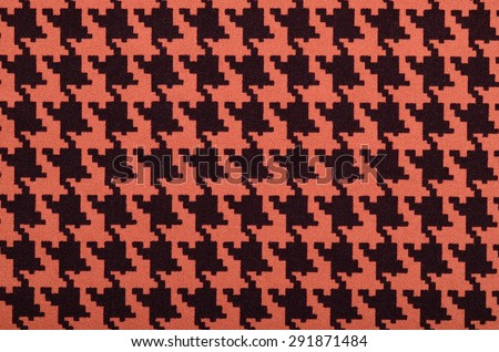 Orange and black houndstooth pattern. Dogstooth check design as background.