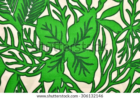 Pattern with leaves on white fabric. Green graphic leaf print as background.
