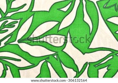 Pattern with leaves on white fabric. Green graphic leaves print as background.