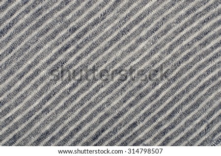 Blue striped background. Blue and white diagonal stripes pattern on fabric.