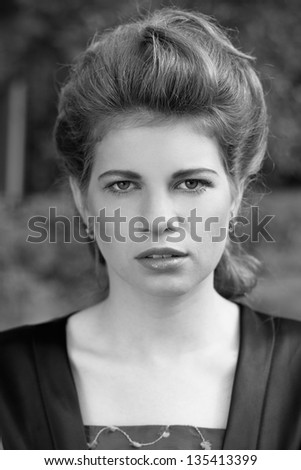 Portrait of a beautiful woman in a nature, fashion photography, black and white photo