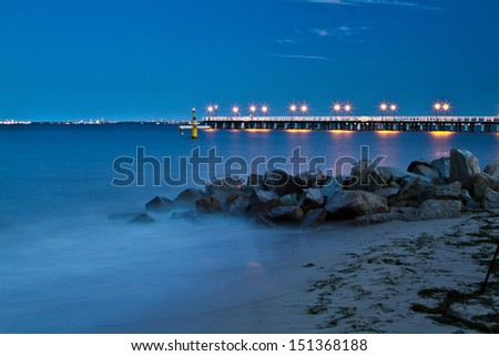 Baltic pier in Gdynia Orlowo at night, Poland. Sunset ot the sea. Long exposure photography
