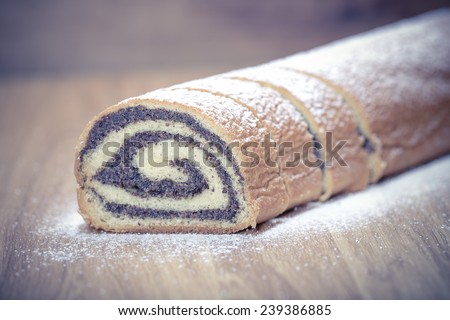 poppy seed Roll on a wooden surface. Polish traditional Christmas cake