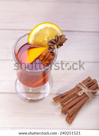 Hot Christmas tea with cinnamon, cardamom, cloves, anise and orange